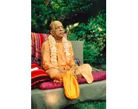 Prabhupada Outside on Vyasasana on Grass with Big Beadbag