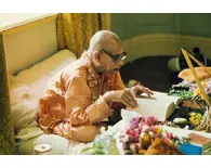 Prabhupada Reading Book at his Desk