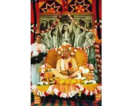 Srila Prabhupada at Rathayatra Festival Playing Kartals on Yellow  Vyasasana in front of Big Panca-Tattva Painting