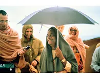 Prabhupada Smiling on Morning Walk with Disciples