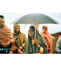 Prabhupada Smiling on Morning Walk with Disciples