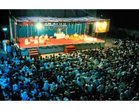 Prabhupada With a Group of Disciples at a Preaching Program in India